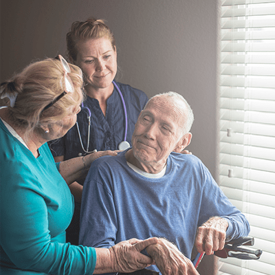 nurse and doctor supporting hospice patient