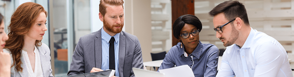 depicts a meeting, several people in business attire observing their notes.