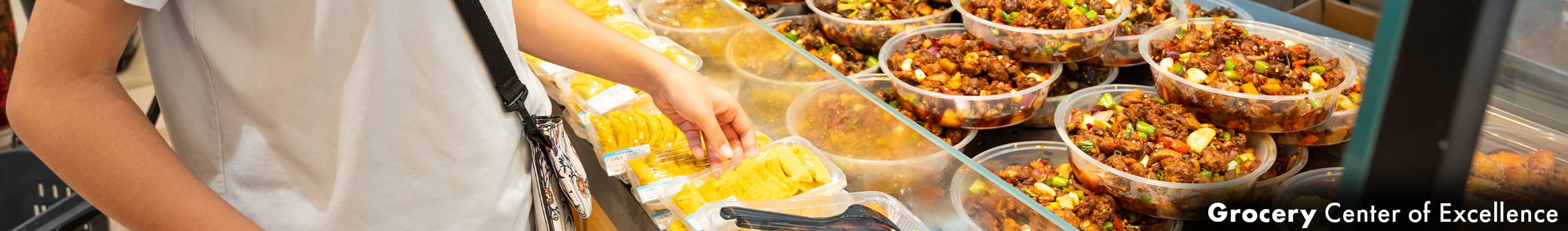 two cooks in striped apron, cooking in a restaurant, fire rising off the skillet in a heated bout of cooking