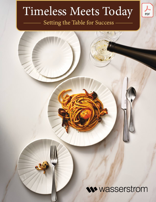 Table set with plates, glasses and flaware.  A wine bottle fills a wine glass