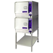 This SteamChef&trade; 3 double stacked steamer includes two 22CET3.1 steamers, a 24" high equipment stand, a 2" high mounting spacer, and common drain and water connection manifold.